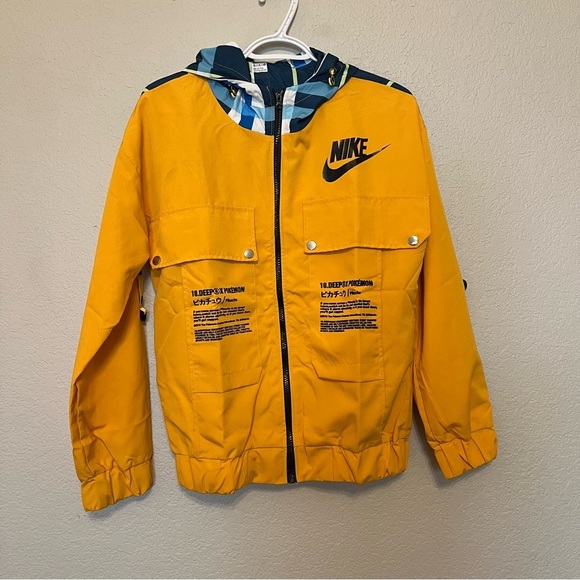 Nike 10 Deep X Pokemon Pikachu Trainer Yellow Windbreaker Jacket Medium - Picture 1 of 13